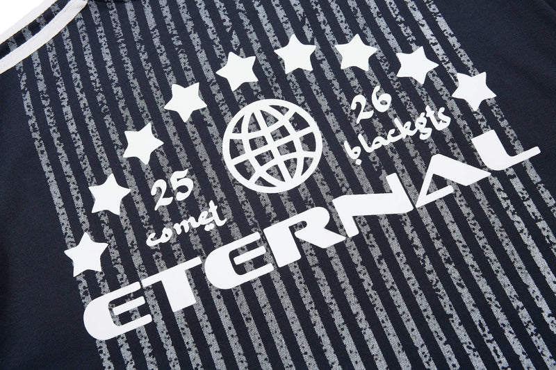 Black sport tee with white stripe graphic, stars, and globe logo print, featuring the text GRN26 and 25 combat detail