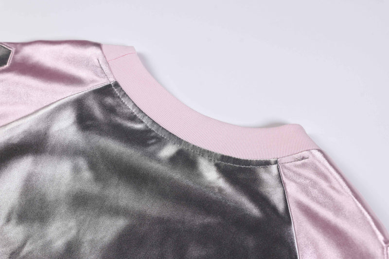 Metallic pink and silver varsity jersey tee with ribbed collar and shiny oversized football shirt fabric