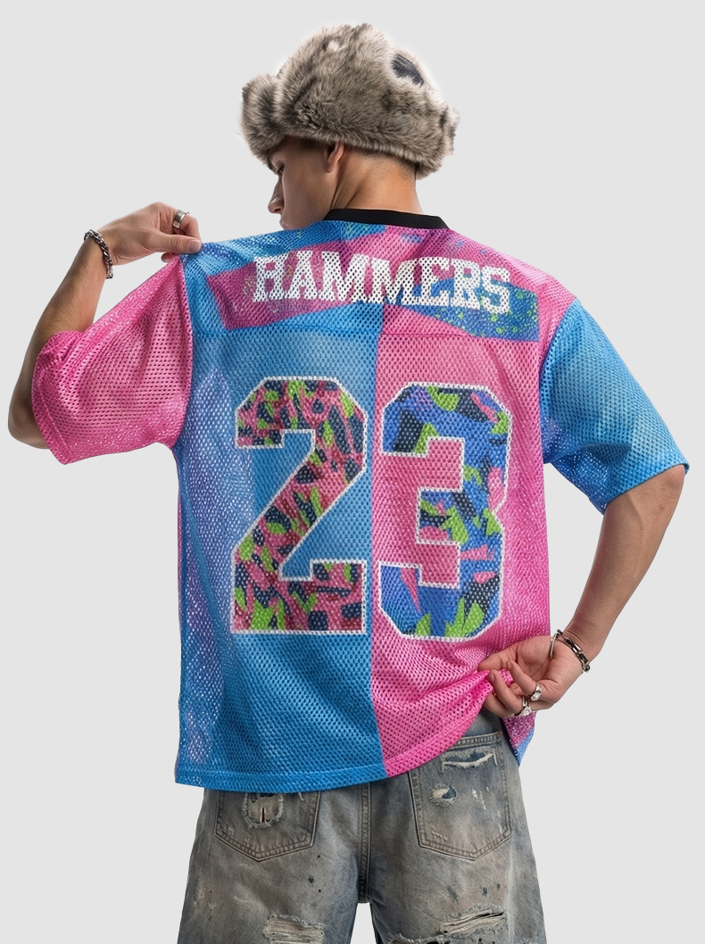 Split-color pink and blue mesh jersey shirt with Hammers 23 graphic on the back, worn with distressed jeans and fur hat