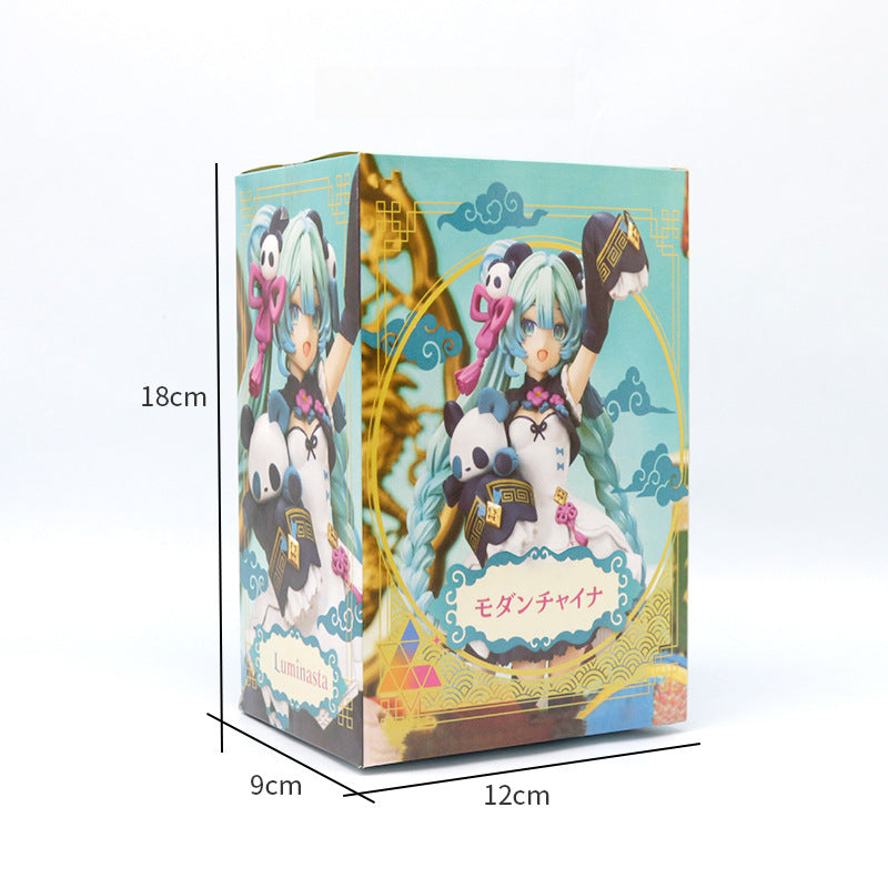 The box of the Hatsune Miku Panda-themed 18cm PVC Figure showcases an illustrated character with long turquoise hair and a white dress, holding a book and toy panda. The dimensions are 18 cm tall, 9 cm wide, and 12 cm deep, and it features Japanese text on the front.