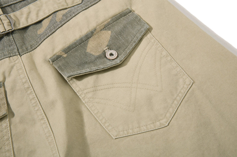 Close-up of beige rear pocket with camo flap and stitched detail