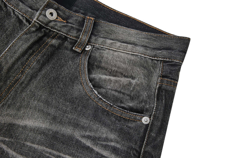 Close-up of front right pocket on faded black jeans with coin pocket and contrast stitching