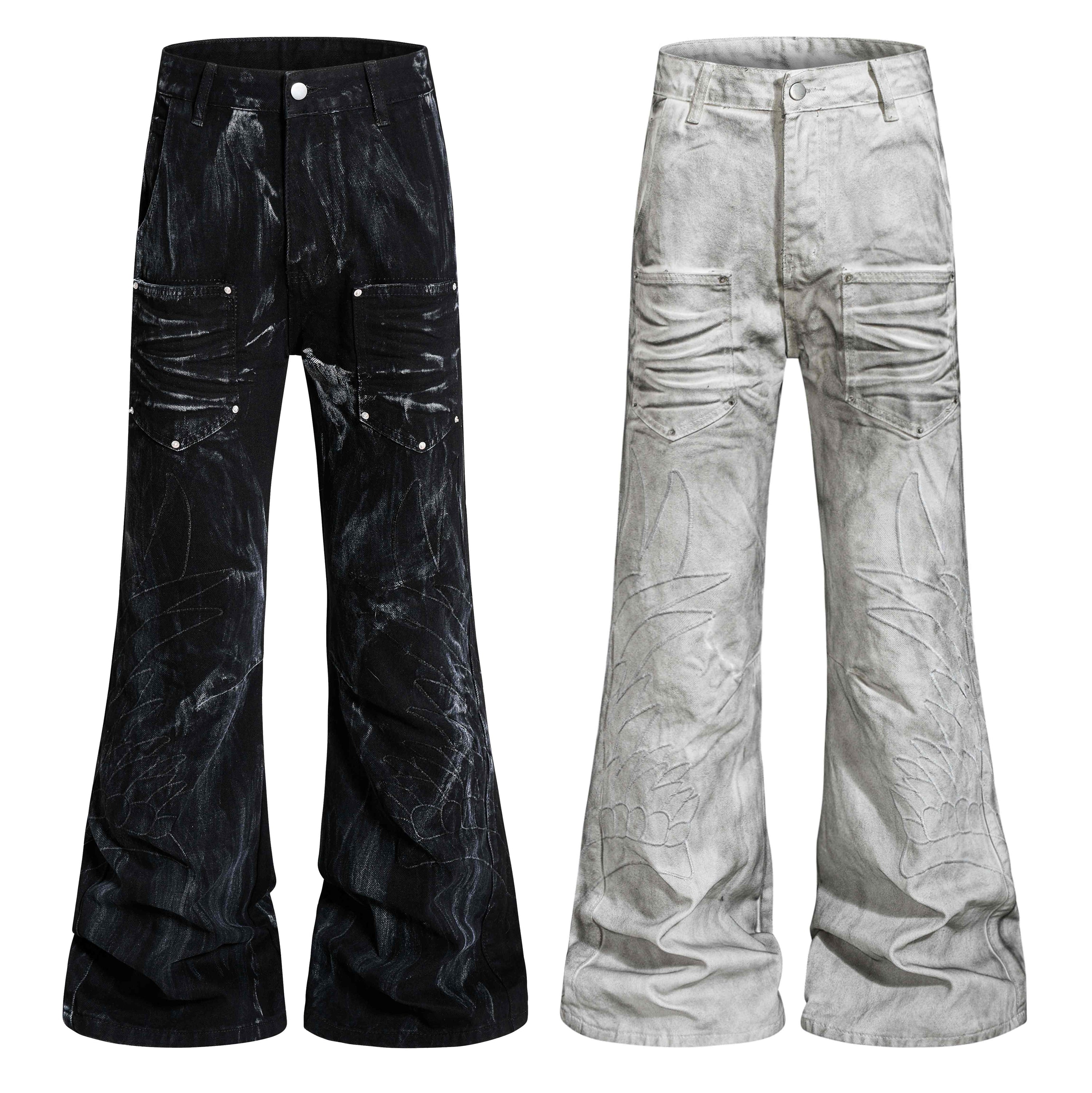 Front view of black and grey washed utility flare jeans with cargo pockets, rivet accents, and embroidered wing leg artwork