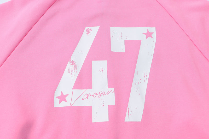 Back chest close-up of pastel pink hoodie with white 47 star graphic
