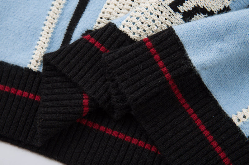 Close-up of black cuff with red stripe and blue-and-cream knit sleeve