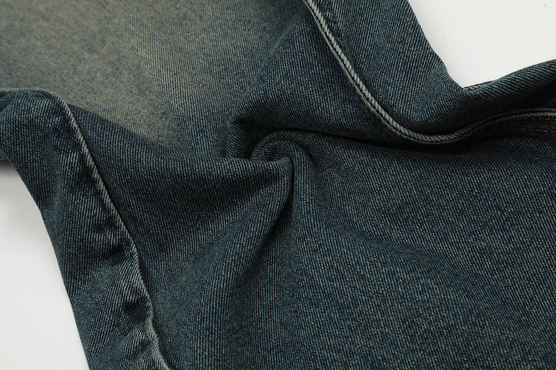 Close-up of folded denim showing interior waistband and seam stitching