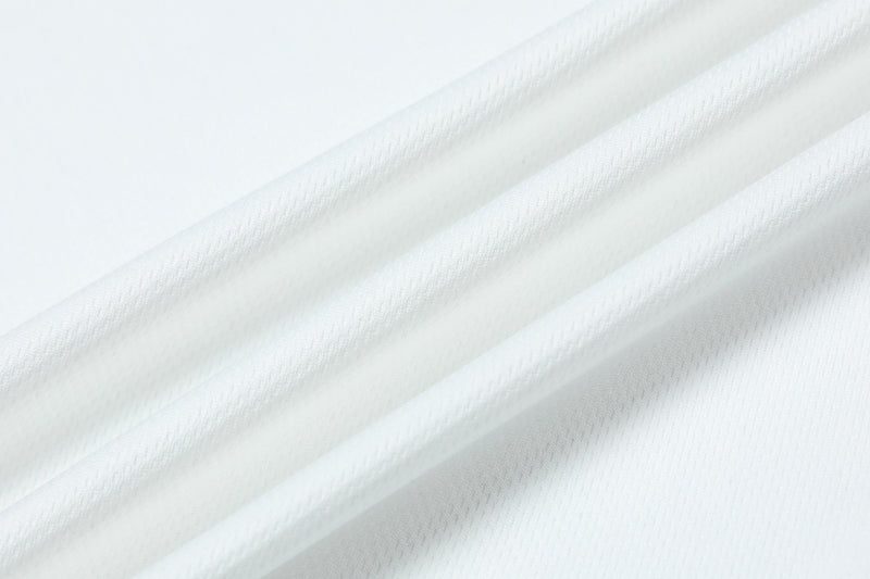 Close-up of white textured fabric with subtle diagonal pleats for a clean athletic jersey tee look