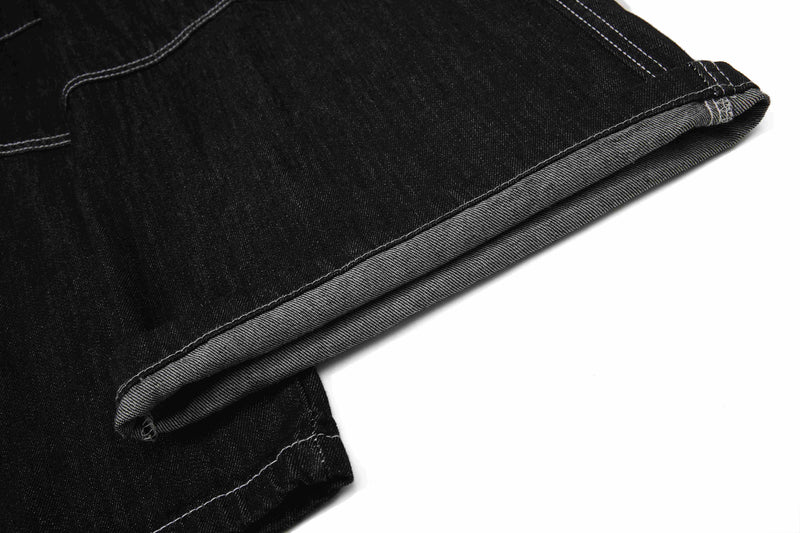Close-up of folded black denim hem and inner seam