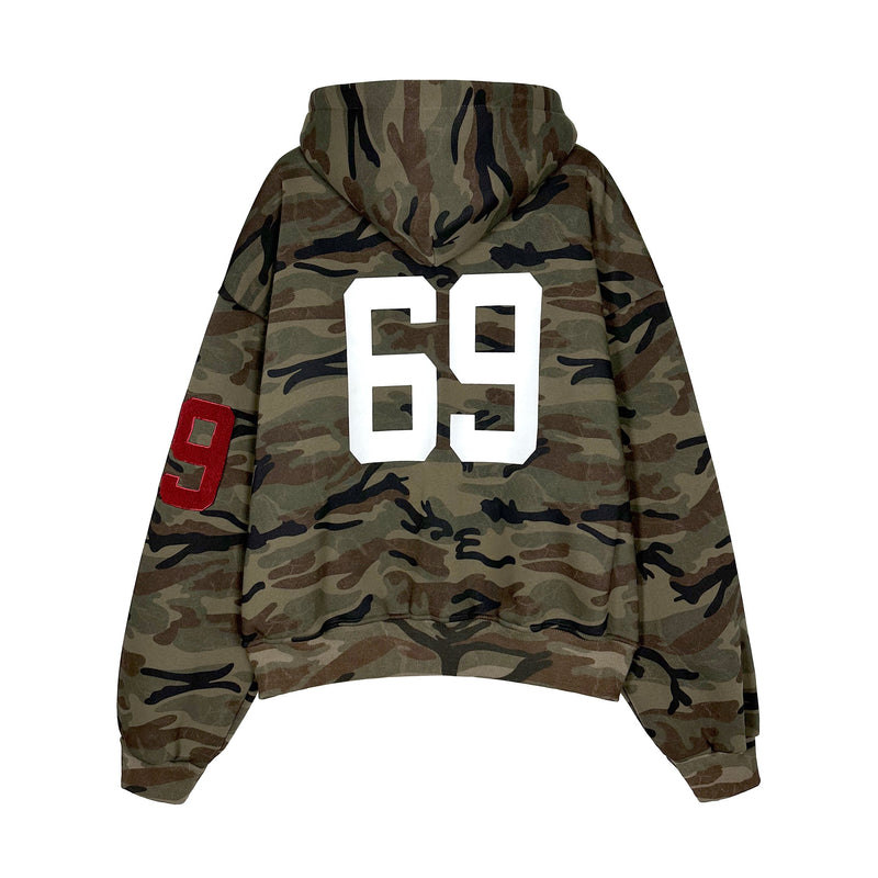 Back view of camo zip hoodie with large white 69 print and red sleeve patch