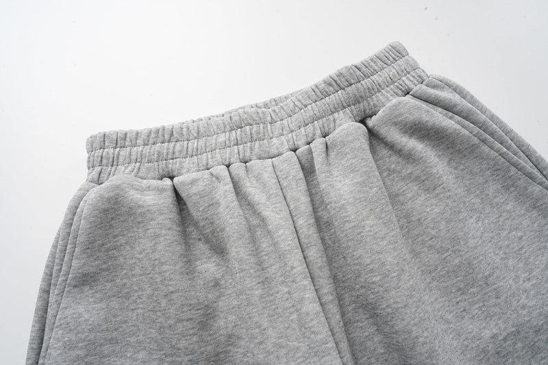 Close-up of gray heathered elastic waistband and pleated fabric texture