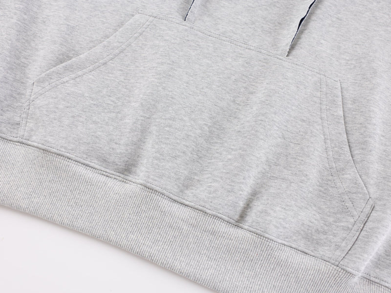 Close-up of gray hoodie kangaroo pocket and hem