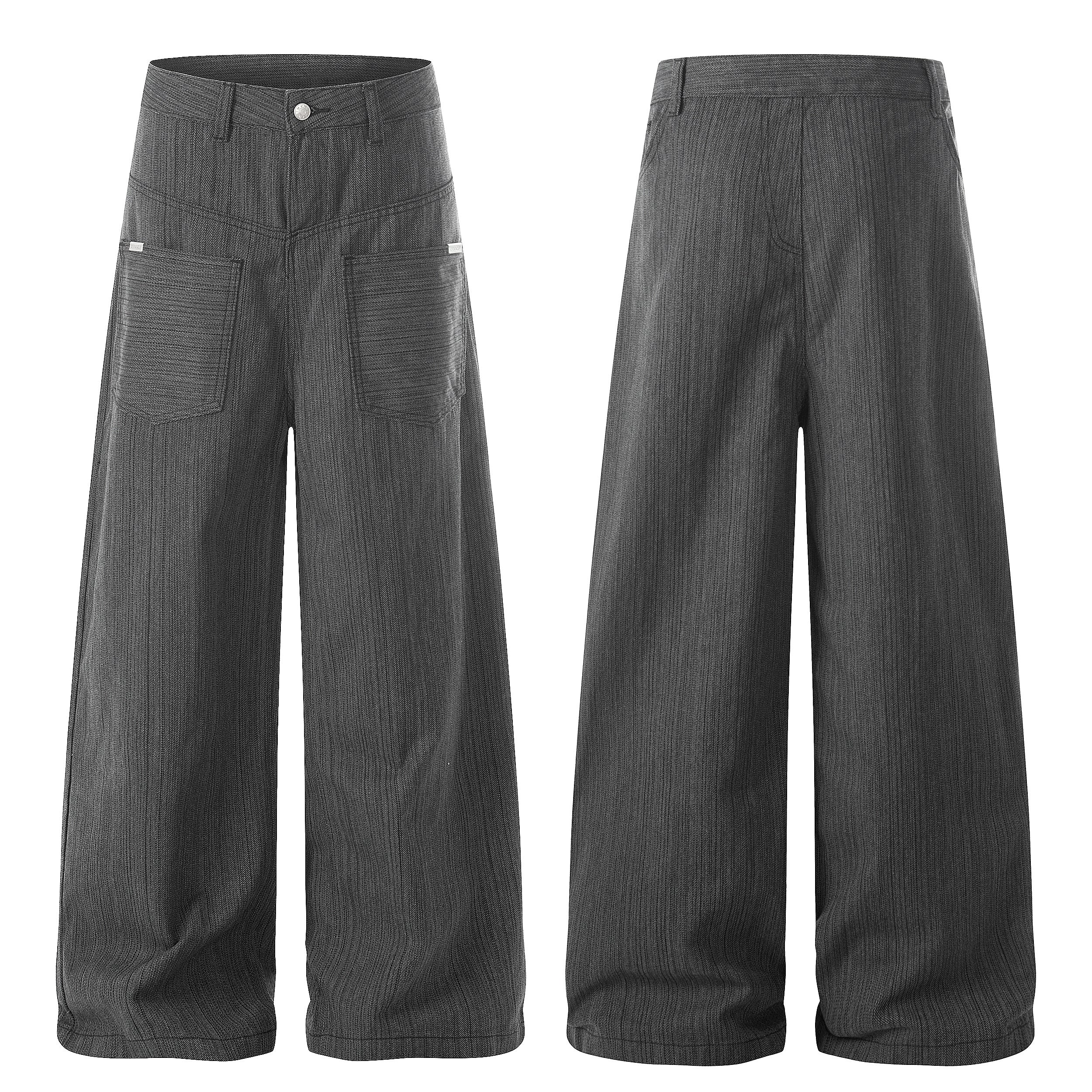 Front view of dark grey textured wide-leg utility pants with large patch pockets and button waistband