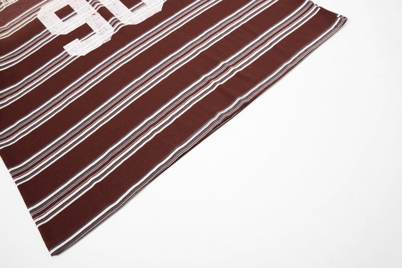 Brown vintage striped rugby polo shirt with white retro graphic number print on a white background