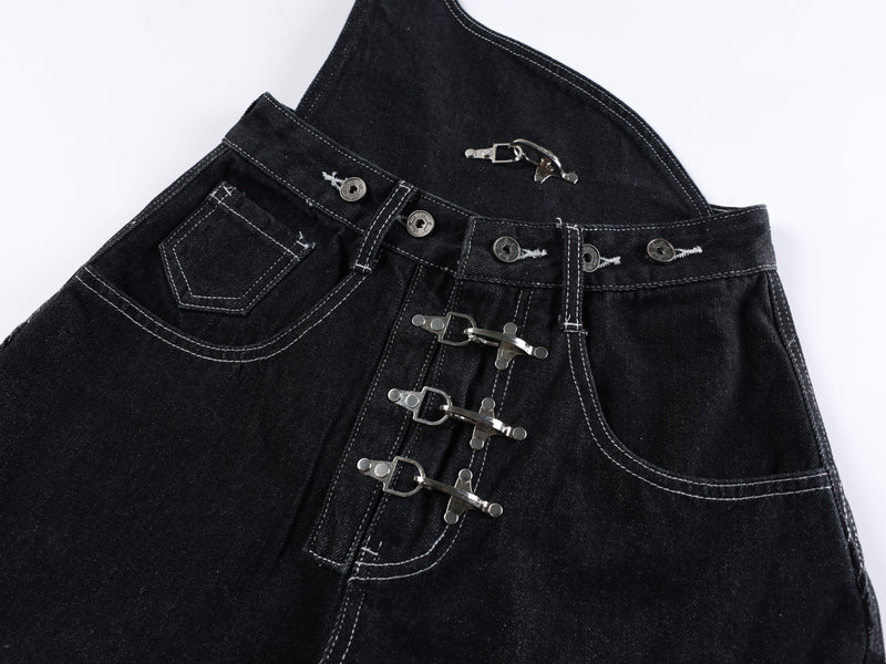 Close-up of black jeans waist with front pocket, button detail, and three metal buckles