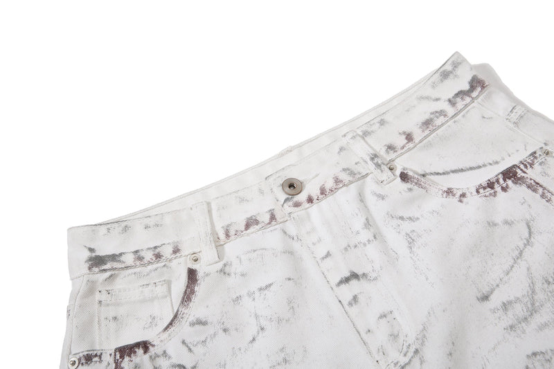 Close-up of waistband and front fly on white washed denim pants with metal button