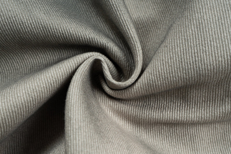 Close-up of washed grey cotton fabric with visible ribbed weave