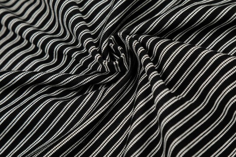 Close-up of gathered black-and-white striped fabric on the hoodie