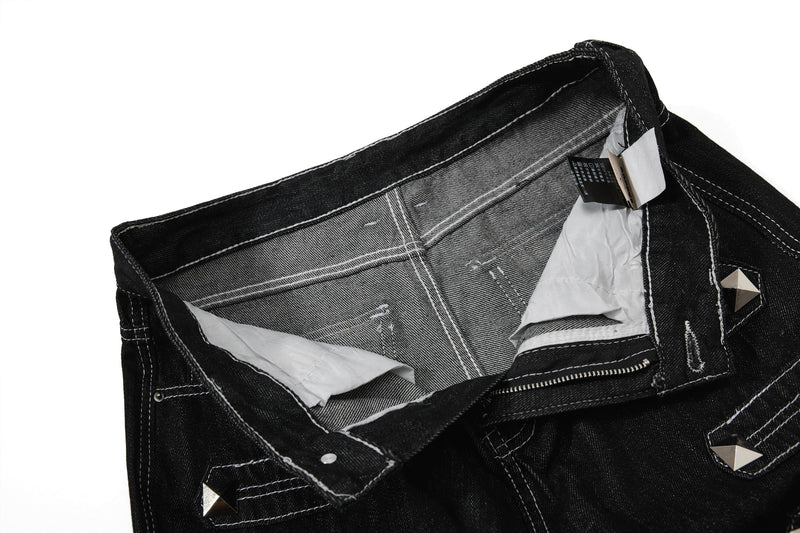 Inside view of black denim waistband and pocket lining with care tags