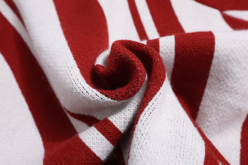 Close-up of red and white striped knit fabric gathered in folds