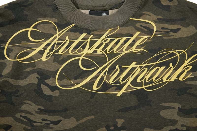 Artskate camo graphic T-shirt with large yellow script logo on olive green camouflage fabric