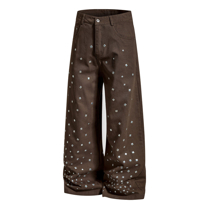 Brown wide-leg denim pants with silver stud squares, angled front view
