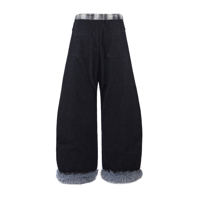 Back view of black denim barrel leg pants with gray plaid waistband and faux fur hem