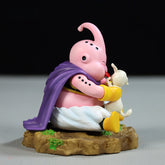 The Seakoff Majin Buu Collectible Figure is a must-have for anime fans, featuring a pink cartoon character with a purple cape and white pants sitting on a rocky base, holding a small white bunny. This 8.5cm Dragon Ball Z statue has an antenna-like head and yellow gloves.