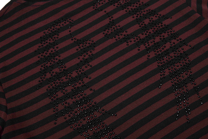 Maroon and black striped tee with rhinestone gothic script detail across the front