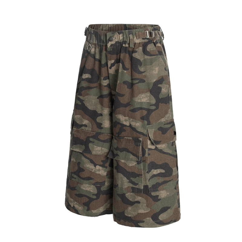 Front angled view of green brown camouflage cargo shorts with elastic waist and cargo pockets