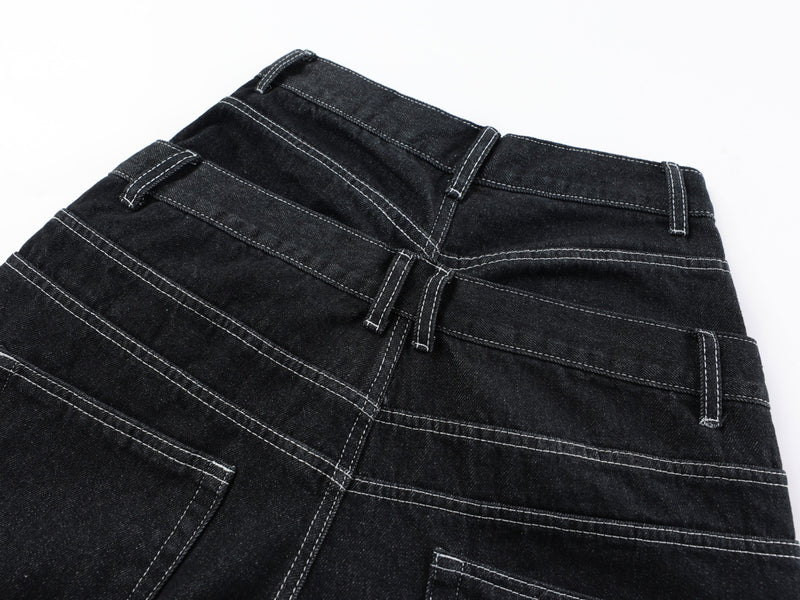 Close-up of the back waistband and belt loops on black denim pants