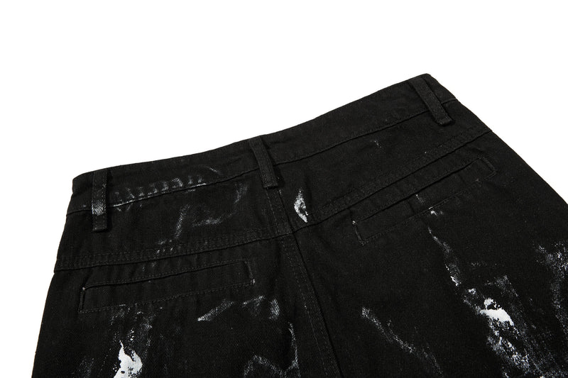 Back waistband close-up of black washed denim with belt loops and top pockets