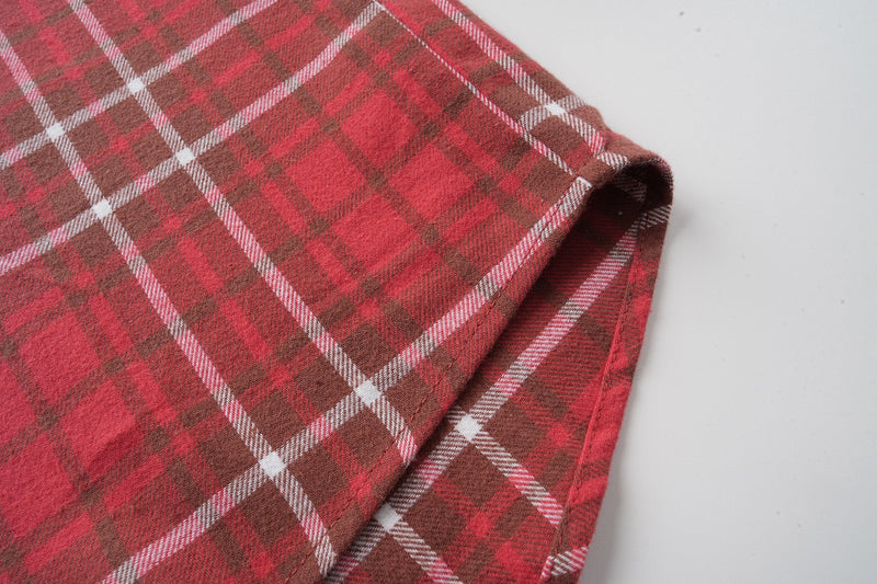 Red plaid flannel shirt sleeve hem and side seam detail