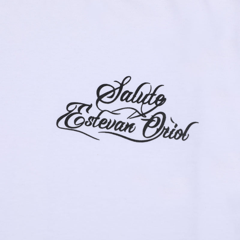 White oversized tee with black Saludo Estevan Oriol script graphic on the chest