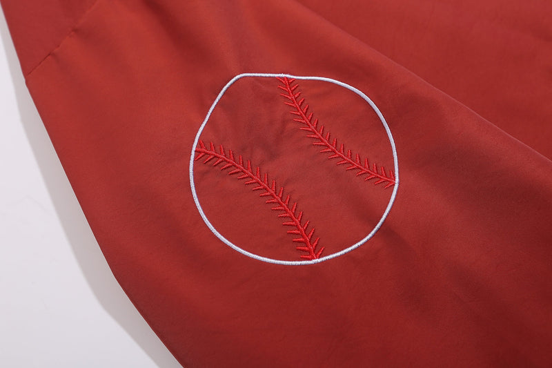 Close-up of red sleeve baseball patch embroidery with white outline