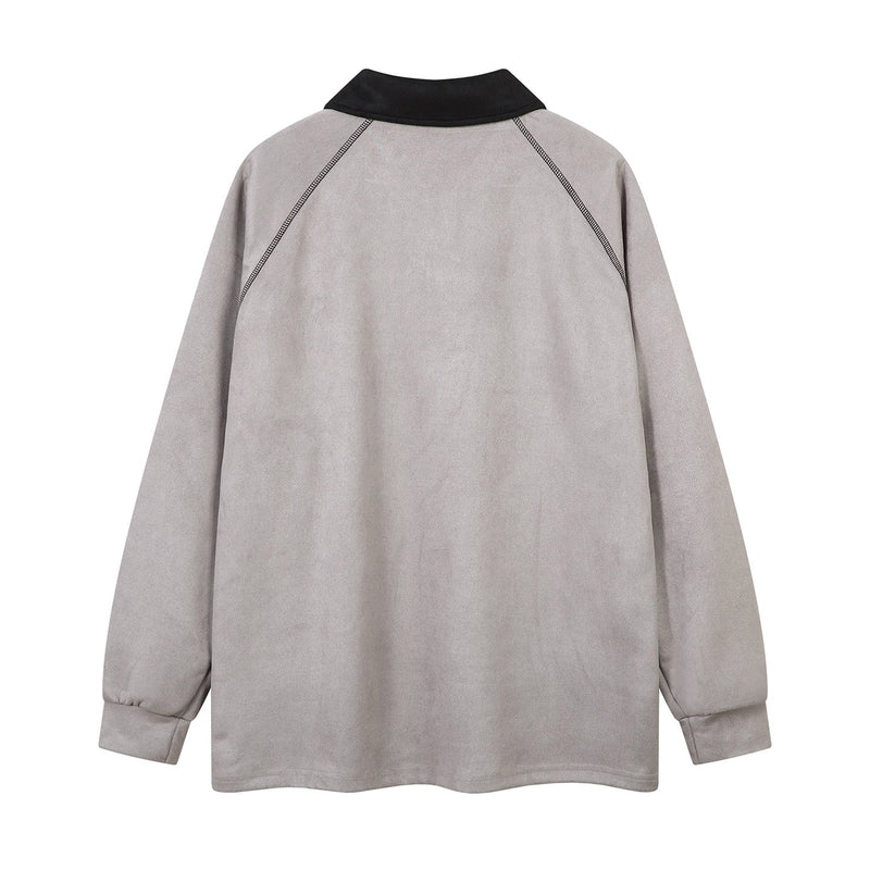 Back view of light gray long-sleeve polo shirt with black collar and contrast shoulder seams