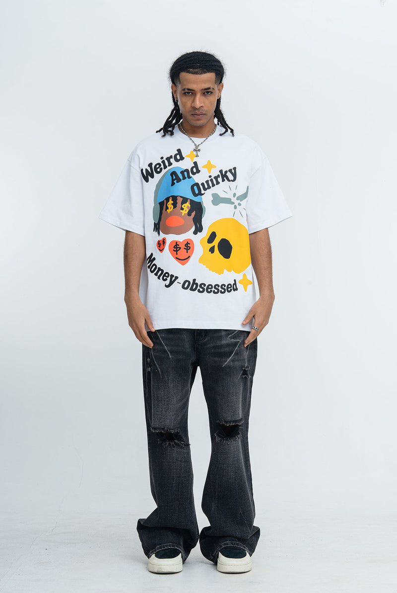 White oversized graphic tee with quirky money-obsessed cartoon print, worn with black ripped jeans and sneakers