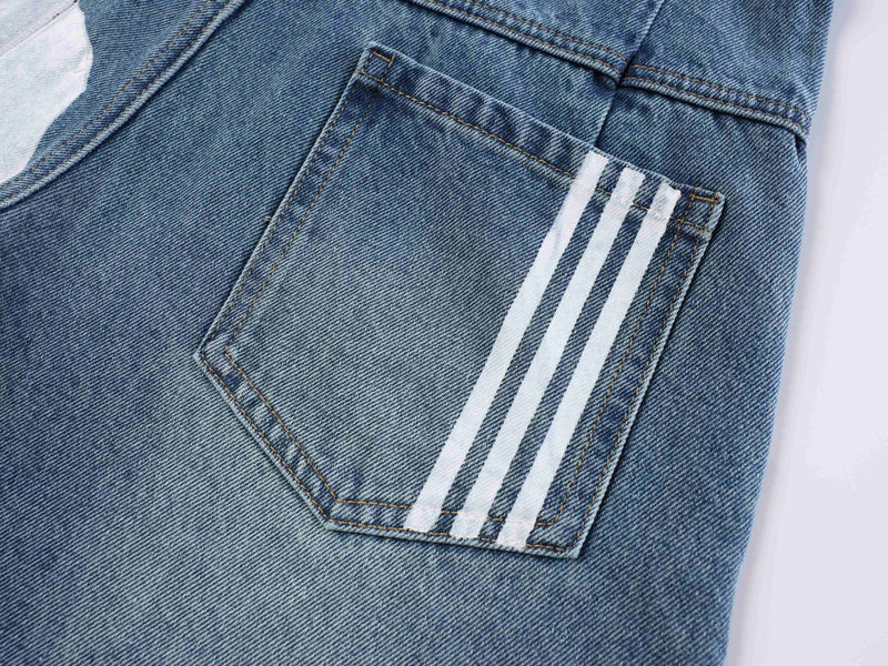 Close-up of blue denim back pocket with three white side stripes