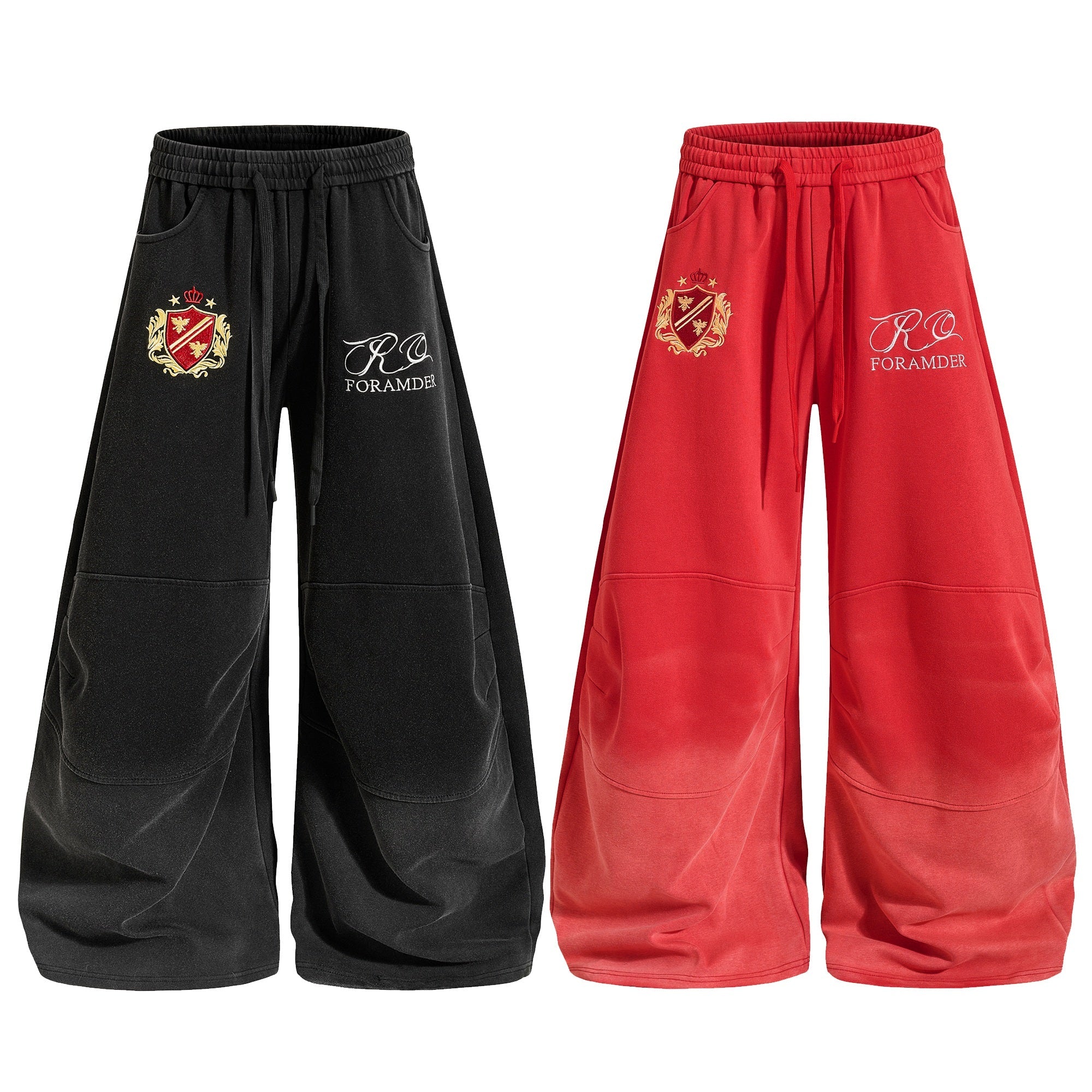 Black and red oversized balloon sweatpants with embroidered heraldic crest and script logo on left thigh, elastic drawstring