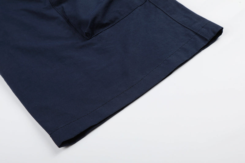 Close-up of navy cargo pants hem showing straight wide-leg opening
