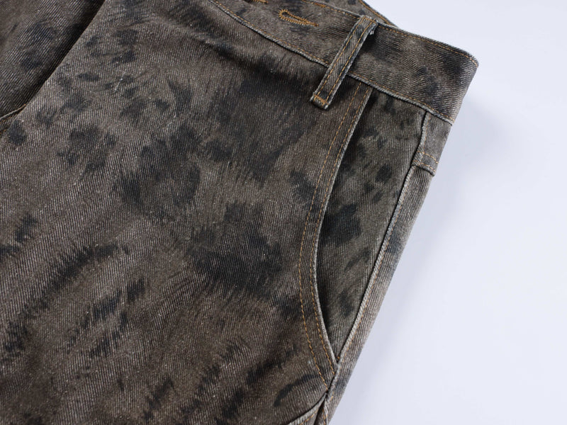 Side back panel close-up of dark washed denim jeans with seam and belt loop