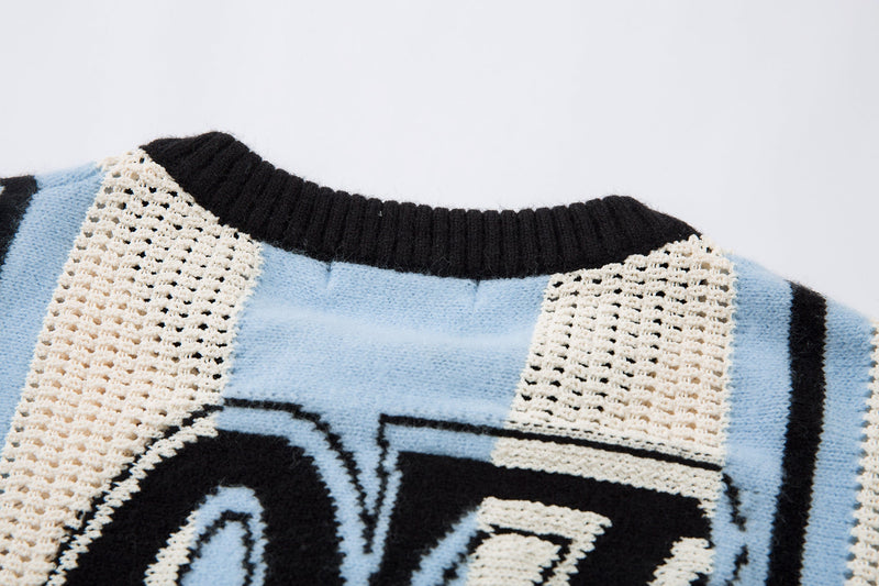 Close-up of black ribbed collar on light blue and cream striped knit sweater