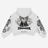 The Zenitsu Agatsuma-Inspired "Thunder God" Hoodie by Demon Slayer is a Limited Edition streetwear piece featuring a black illustration of Zenitsu with lightning and "Thunder" text. Sleeves are adorned with dragon images and additional anime-themed text.