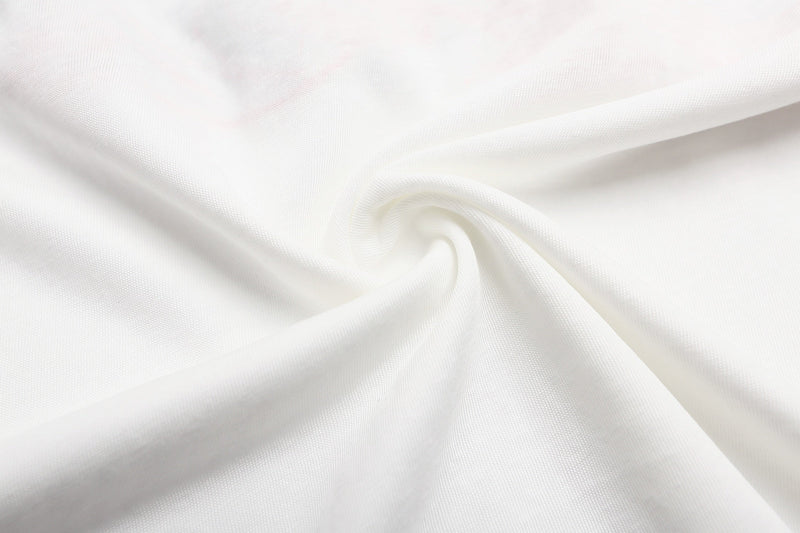 White vintage graphic T-shirt fabric with soft folded texture and clean minimalist streetwear style