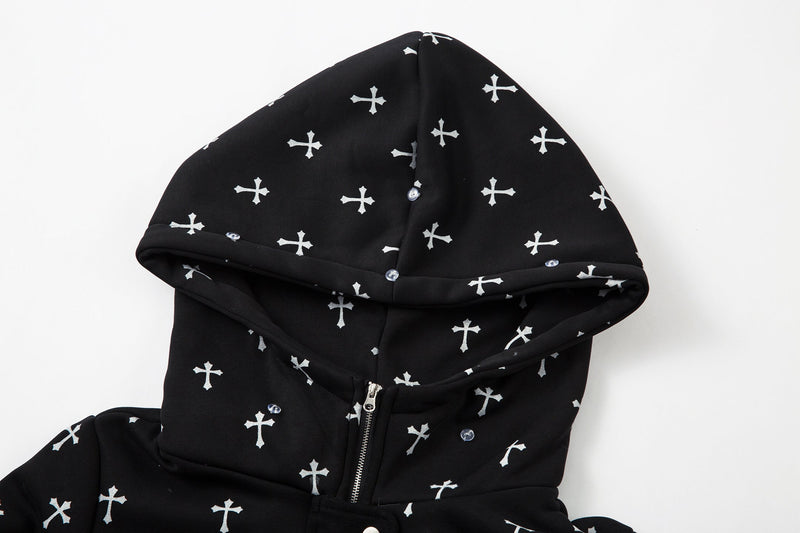Close-up of black hooded bomber jacket front with white cross print and zipper