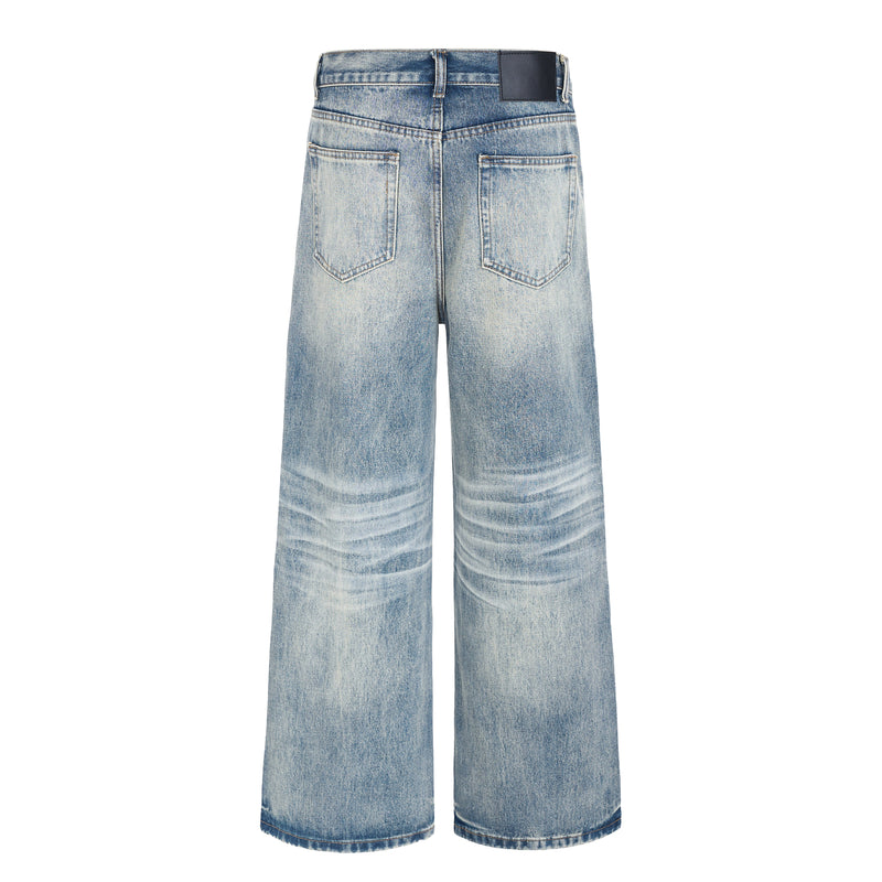 Back view of light-wash wide-leg jeans with patch pockets and dark waistband label