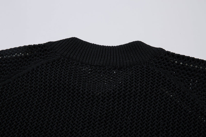 Black ribbed collar detail on mesh knit track jacket close-up