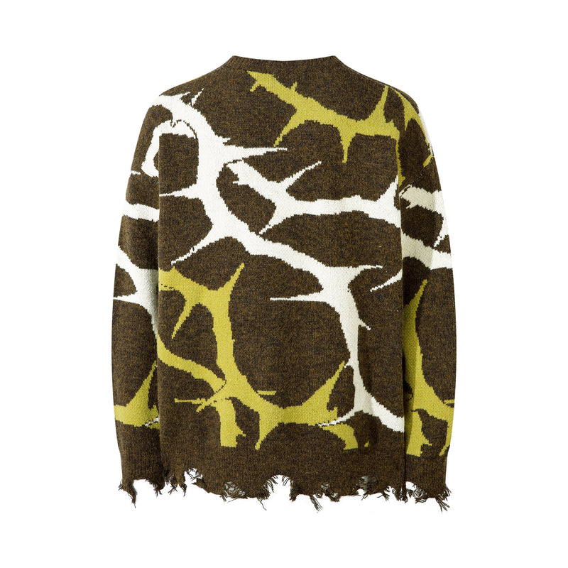 Oversized crew neck knit sweater with brown, white and yellow abstract camo pattern, back view