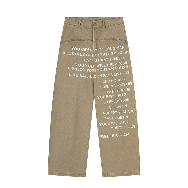 Wide-leg khaki pants with large white text print, front view