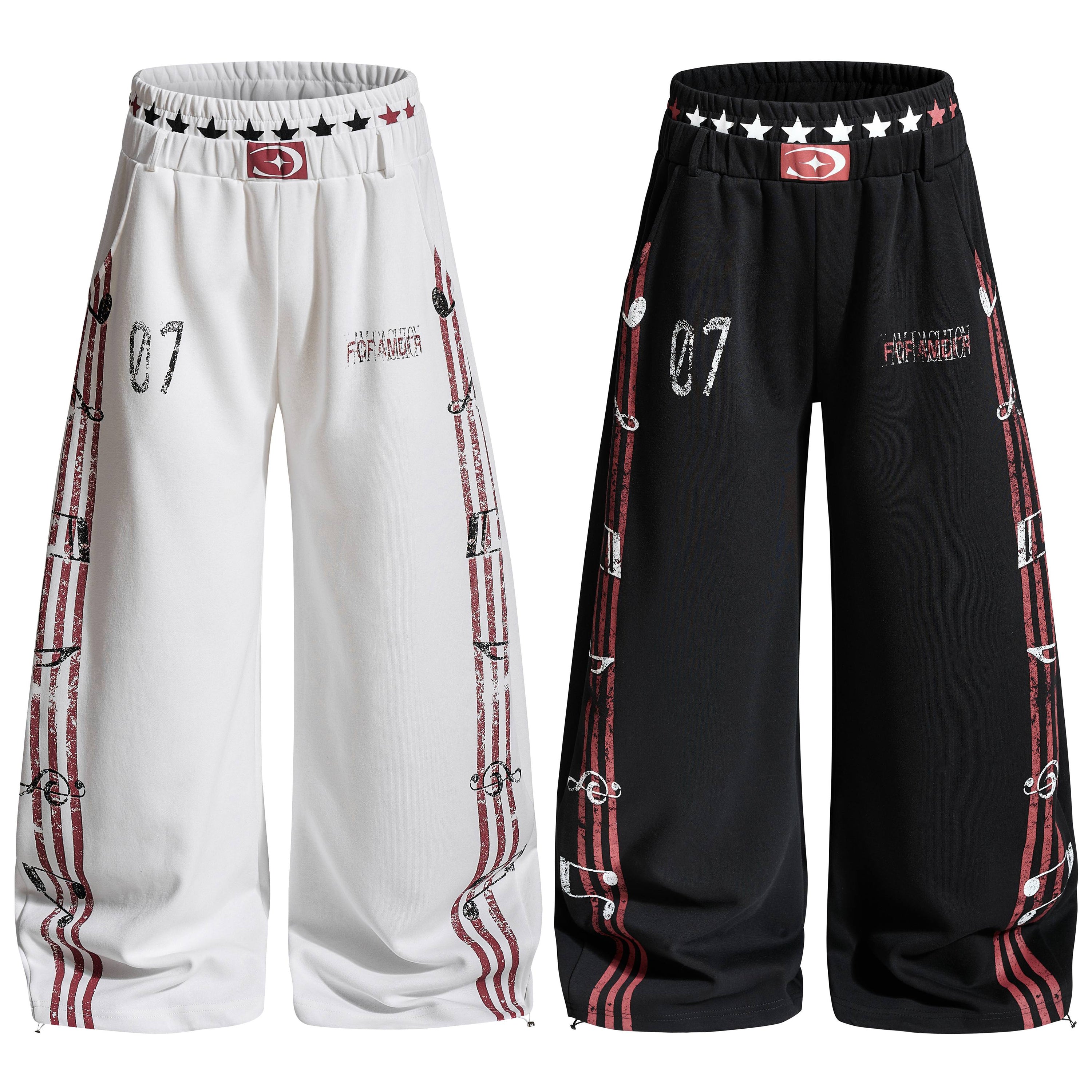 Omirad wide-leg sweatpants in white and black with red vintage stripe graphics and star elastic waistband, front view