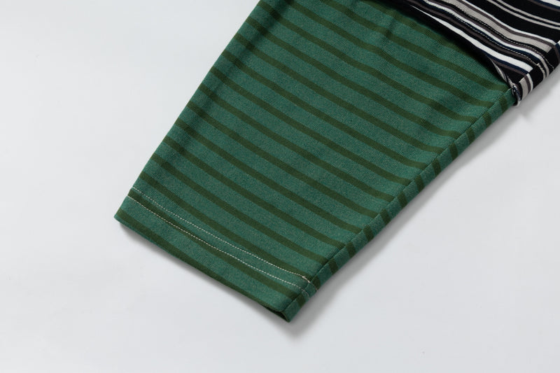 Close-up of green striped sleeve cuff on the long sleeve tee